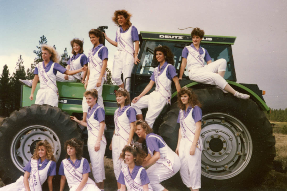 Lilac princesses on tractor at Empire Machinery in 1987. Kristina Kripaitis, of Shadle Park, was selected as queen this year.