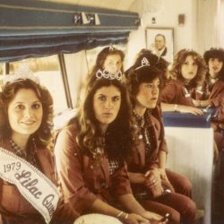 Queen Earla Schafer of North Central High along with princesses on a McDonalds bus during hospital visitation in 1979.