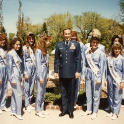 Colonel Arnie Weinman poses with Lilac royalty at Fairchild Air Force Base in 1990.